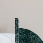 Elegant Space - Stylish green bookend on marble table