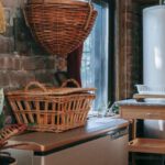 Kitchen Storage - Interior of kitchen with brick wall decorated with wicker baskets