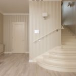 Built-in Shelves - Interior of spacious cozy hallway with beige striped walls and light stairs and furniture