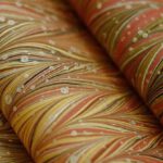 Biophilic Design - A close up of a stack of fabric with different colors